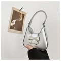Silver metallic PU leather handbag with a 3D bow decoration and sleek top handle - Silver
