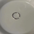 Minimalist silver open ring with smooth polished finish on white ceramic dish - Minimalist Plain Open Ring (J2824)