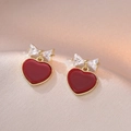 Gold-tone bow stud earrings featuring red heart pendants and clear zircon stones - Bow Red Heart (E0157) / Gold/Red