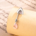 Silver cat ear navel ring with pink teardrop crystal on vintage newspaper backdrop - Pink + Pink (Left)