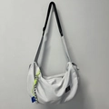 Light grey crescent sports bag with waterproof nylon and neon green zipper detail - Gray + Green Lanyard