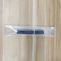Navy blue cylindrical object with gold ring in a transparent PVC jewelry zip bag - Slider Bag 23*4.5cm