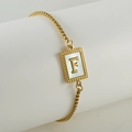Gold-plated box chain bracelet featuring shell letter F pendant with beaded frame - Letter F