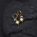 Detail of 14K gold plated hoop earrings with star charms and beads on black stone - Eight-pointed Star White Rice Beads