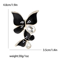 Elegant gold butterfly brooch with black enamel, white pearls and crystal details - Black