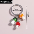 Vista dettagliata dei ciondoli a fungo colorati con anello, misura 7,5cm e peso 11,4g - Fungo Colorato