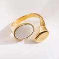 Detail of 18K gold plated ring featuring white mother of pearl and teardrop design - R01022-Gold Oval White Stone