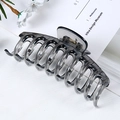 Detail of a large translucent grey hair claw clip showing durable teeth and spring - Jelly Transparent Grey