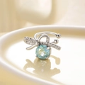 Silver bow ear clip with light blue faceted gemstone and clear zircon accents - Right Ear / Light Blue (Mint)