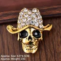 Retro golden skull brooch with cowboy hat and sparkling crystals on wooden background - Antique Gold Cowboy Skull (XZ25140)