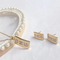 Golden titanium steel jewelry set with rectangular zircon charms and NZU lettering - Set 2717 Gold Letter