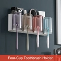 Wall-mounted bathroom toothbrush holder with four colorful cups and storage shelf - 4-Cup Set