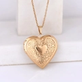 Polished gold heart locket necklace featuring detailed floral embossing and metal shine - Convex Wreath Heart/Rose Gold