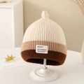 Detailed knit texture of a three-color striped baby beanie with a white fabric patch - 1-3 Years / Beige