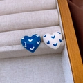 Detail of heart-shaped blue and white enamel earrings with V-pattern in a jewelry box - Blue-White (V-Pattern Heart)
