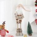 Detail of a plush Christmas gnome holding a HO HO HO flag with warm holiday vibes - Small Santa / 15x40-55cm