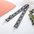 Close-up of blue and white geometric woven strap with silver swivel snap hooks and buckle - Light Gold Buckle / Green Bohemian