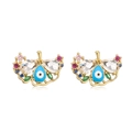 Detalle de pendientes de ojo turco en oro con esmalte azul y acentos de circonita clara - Mariposa Circonita Multicolor Dorado
