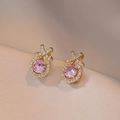 Golden bow earrings featuring a large round pink crystal and sparkling zircons - Pink Round Zirconia Bowknot Style (E0409)