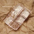 Macro shot of 6-grid box with iridescent natural shell flakes for DIY nail art decoration - #125