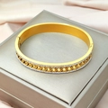 Elegante bracciale in acciaio al titanio dorato con doppia fila di zirconi e maglie vuote - Oro