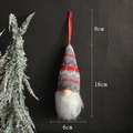 Knitted Christmas gnome ornament in red and grey with dimensions 16cm height and 6cm width - Red and Gray Patchwork (F)
