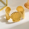 Elegant gold open cuff bracelet with layered scallop shell design in polished finish - Gold Shell Texture
