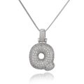 Macro shot of silver letter Q pendant with cubic zirconia on a delicate box chain - Letter Q (DX34-Q)