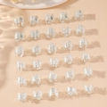 Set of 25 silver hollow rings for dreadlock accessories and DIY hair extensions on beige background - Silver (Set of 30)
