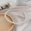 Detail of white faux pearls on elegant headband with protective ends on silk background - 8mm Single Row Pearl Headband