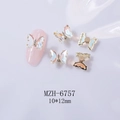 Close-up of 3D rotating pink butterfly nail art charms with aurora crystal wings - 6757 Gold Base + Multi AB + Rotating