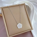 Macro shot of silver flower pendant with clear crystals on a premium jewelry box - Flower Design (K304 Silver) / Silver