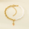 Detail of gold chain and pearl bracelet with a red heart hollow teardrop charm - Red Heart Teardrop (KB203704-Z)