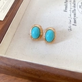 Close-up of vintage gold earrings with oval turquoise stones on a beige display tray - 60# Silver Pin-Gold-Blue