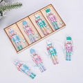 Macro view of nutcracker wood ornaments in pastel colors with storage box - 8pcs Macaron Color Series (Wood Box)