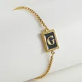 Minimalist 18K gold plated stainless steel chain bracelet featuring a black letter G charm - Letter G (ZH497G-G-02)