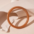 Translucent amber resin geometric round bangle with a vintage polished finish - Brown