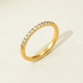 Macro view of gold plated eternity ring showing pavé set cubic zirconia on band - US 6 / White