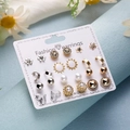 12-pair earring set with gold heart and pearl studs on white display card - Heart Sun Pearl Zirconia Geometric Gold Silver Set (ER23Y0816-10)