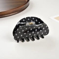 Macro detail of black shark hair claw with white skull print and gold metal spring - Black Skull / 8.2cm
