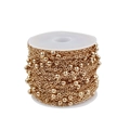 Macro view of gold-plated flat cross bead chain on a white spool for jewelry making - Chain Width 2 Beads Diameter 4 / KC Gold