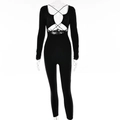Sexy zwarte jumpsuit met lange mouwen, uitgesneden bandage-ontwerp en nauwsluitende open rug - L / Zwart