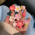 Handheld display of sweet cherry blossom hair clips in pink and white resin finishes - Flower Set of 3 (1213ABC)