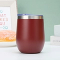 Insulated matte dark red wine tumbler with a clear blue lid on a modern table - 12oz / Burgundy