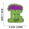 Detail shot of Frankenstein embroidery patch showing green threads and 6cm height dimension - Letter E