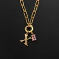 Elegante vergoldete Edelstahl-Büroklammer-Halskette mit Initial X und Rosa Stein - Buchstabe X