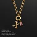 Elegant gold-plated stainless steel paperclip necklace with initial X and pink stone - Letter X