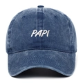 Close-up of the vintage washed blue cotton fabric and white PAPI embroidery on the cap - Navy Blue