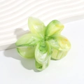 Macro shot of green and white marble floral hair claw clip in acetate material - Gradient Green