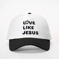 Detail showing high-quality Love Like Jesus embroidery on a two-tone cotton baseball cap - White and Black Splicing